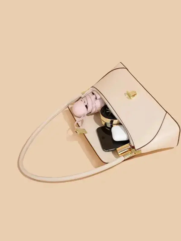 Urban solid leather shoulder bag with zip-up closure, minimalist design, crossbody style, by Plush Fashion Hub.