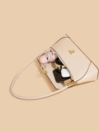 Urban solid leather shoulder bag with zip-up closure, minimalist design, crossbody style, by Plush Fashion Hub.