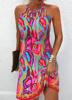 Women's printed sleeveless hollow dress by Trendy Attic Store01, featuring a stylish cut and vibrant floral pattern.