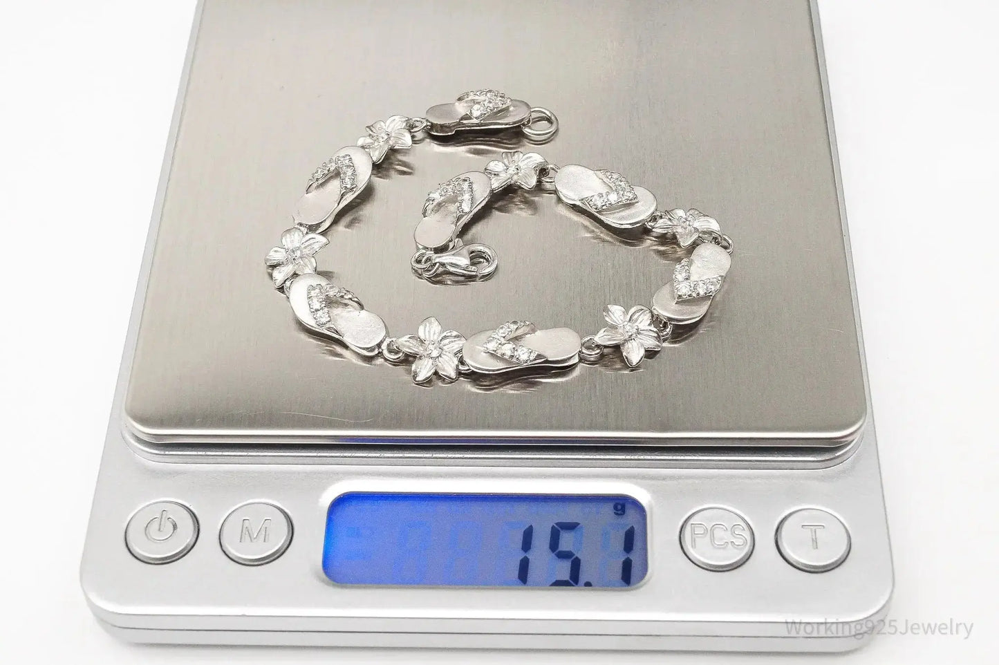 Sterling silver vintage bracelet with cubic zirconia sandals and flower designs, from Plush Fashion Hub jewelry collection.