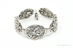 Vintage Danecraft sterling silver bracelet with floral panel design, featuring intricate craftsmanship and classic jewelry style.