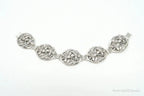 Vintage Danecraft sterling silver bracelet with floral panel design, featuring intricate craftsmanship and elegant jewelry style.