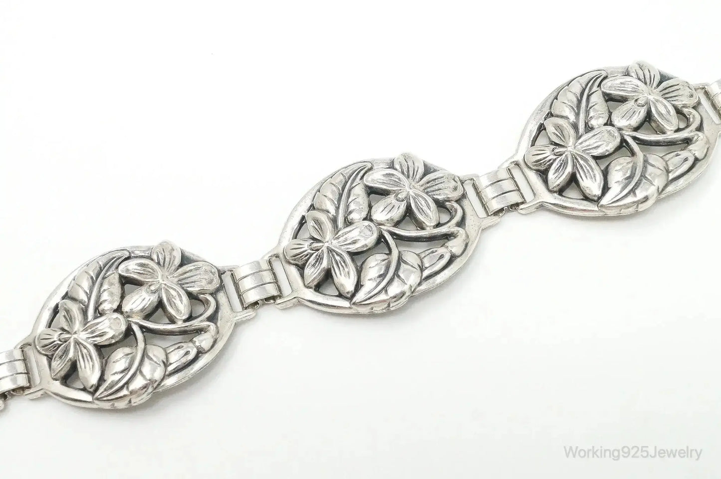 Vintage Danecraft sterling silver floral panels bracelet with intricate floral engravings, jewelry accessory from Plush Fashion Hub