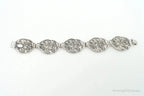 Vintage Danecraft sterling silver bracelet with floral panel design, featuring intricate craftsmanship and elegant jewelry style.
