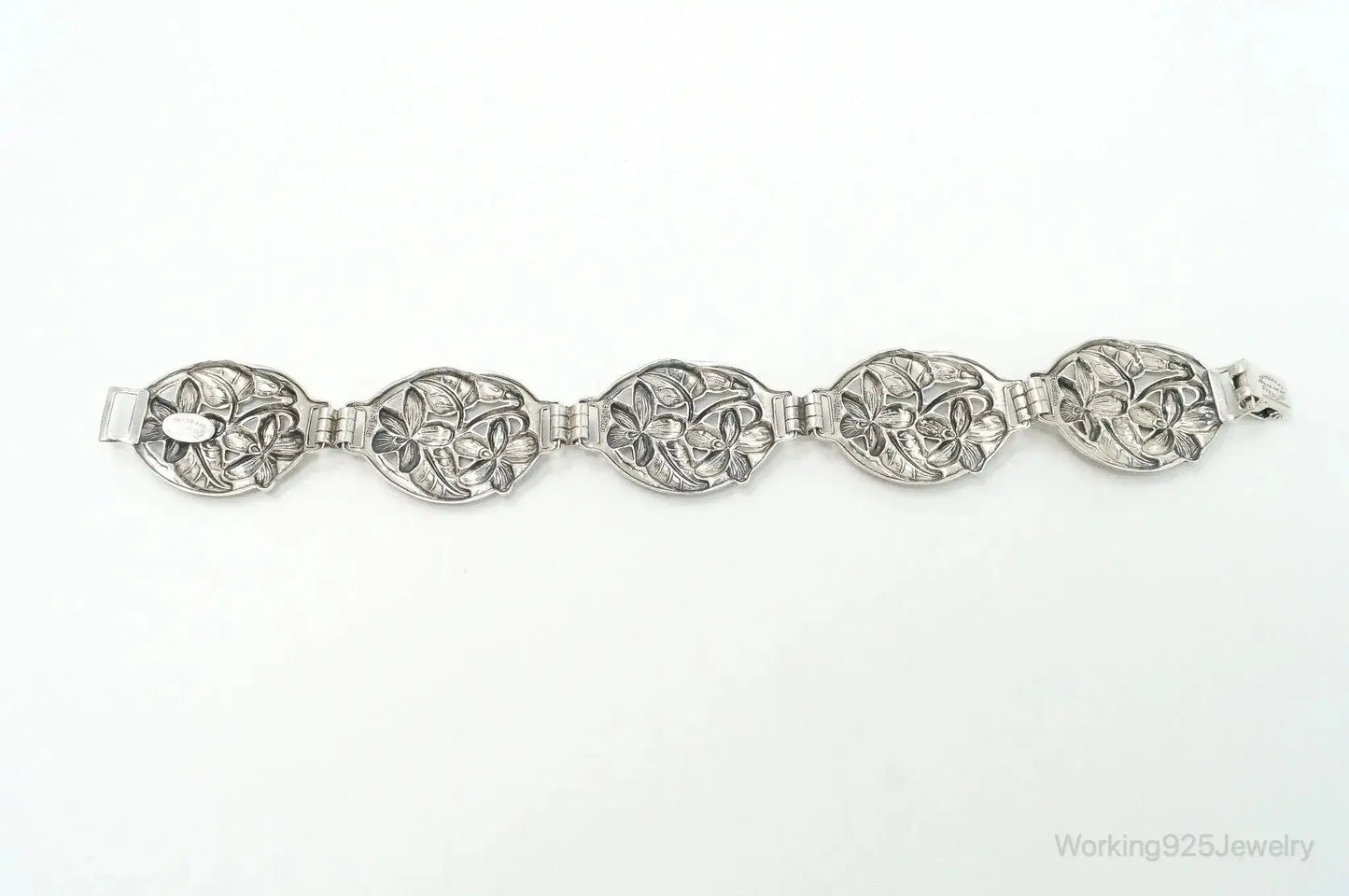 Vintage Danecraft sterling silver floral panels bracelet with intricate floral designs, crafted by Plush Fashion Hub.
