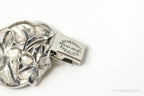 Vintage Danecraft sterling silver bracelet featuring floral panel design, showcasing intricate craftsmanship and timeless jewelry style.