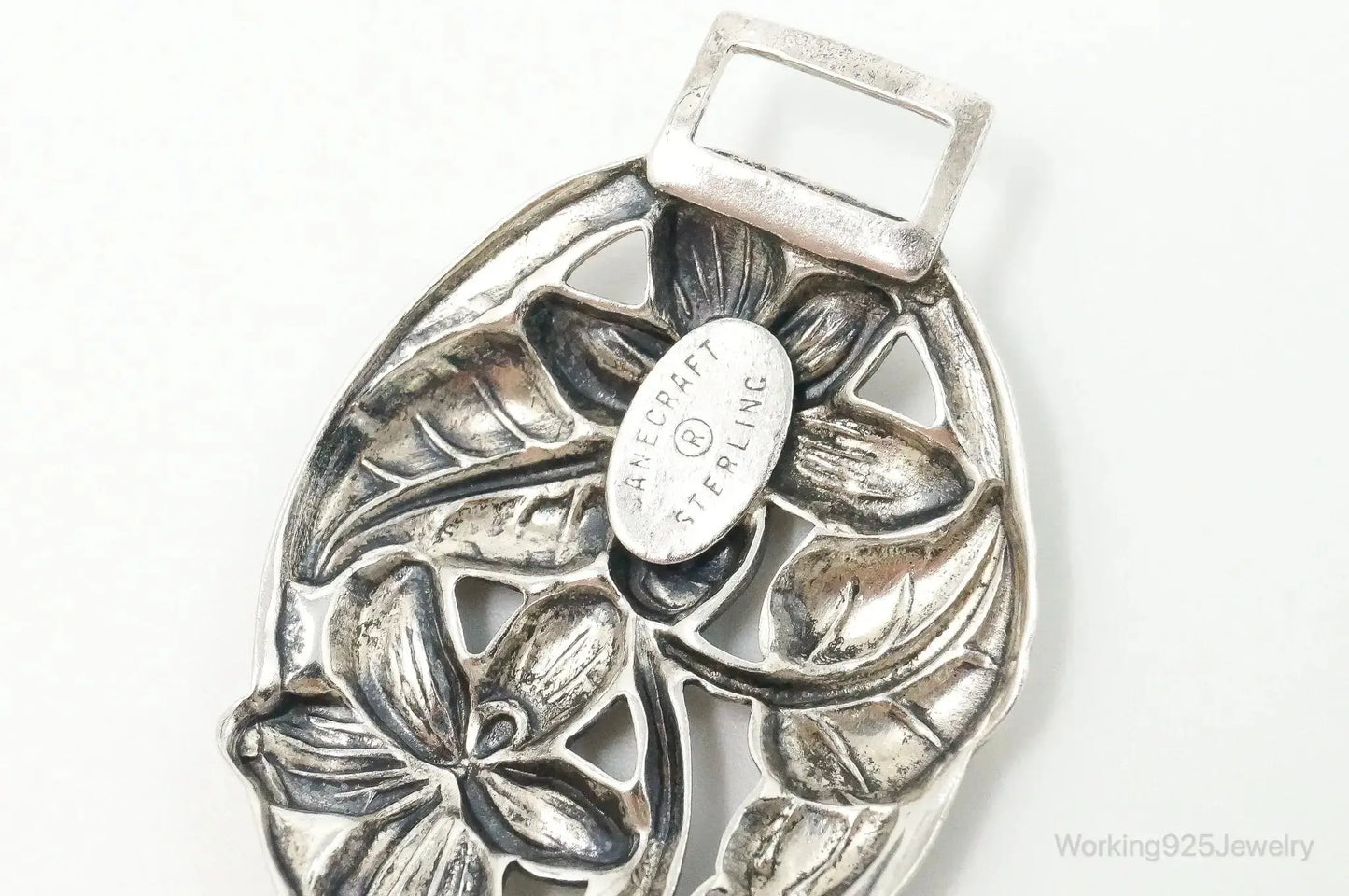 Vintage Danecraft sterling silver floral panels bracelet, intricate jewelry design with detailed floral motifs, elegant bracelet style