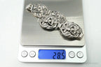 Vintage Danecraft sterling silver bracelet with floral panel design, showcasing intricate jewelry craftsmanship and elegant style.