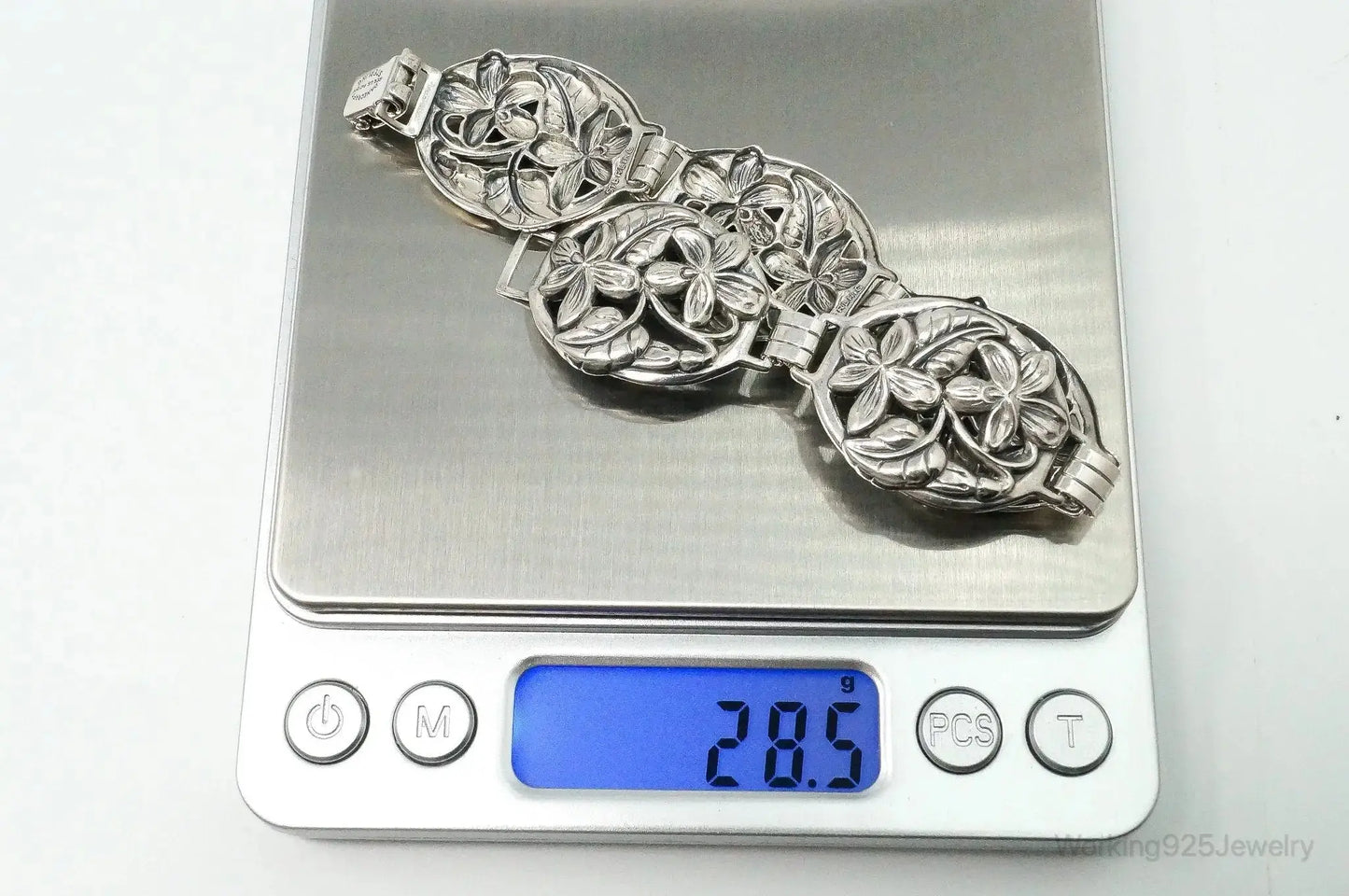 Vintage Danecraft sterling silver floral panels bracelet with intricate flower designs, jewelry accessory for elegant style.