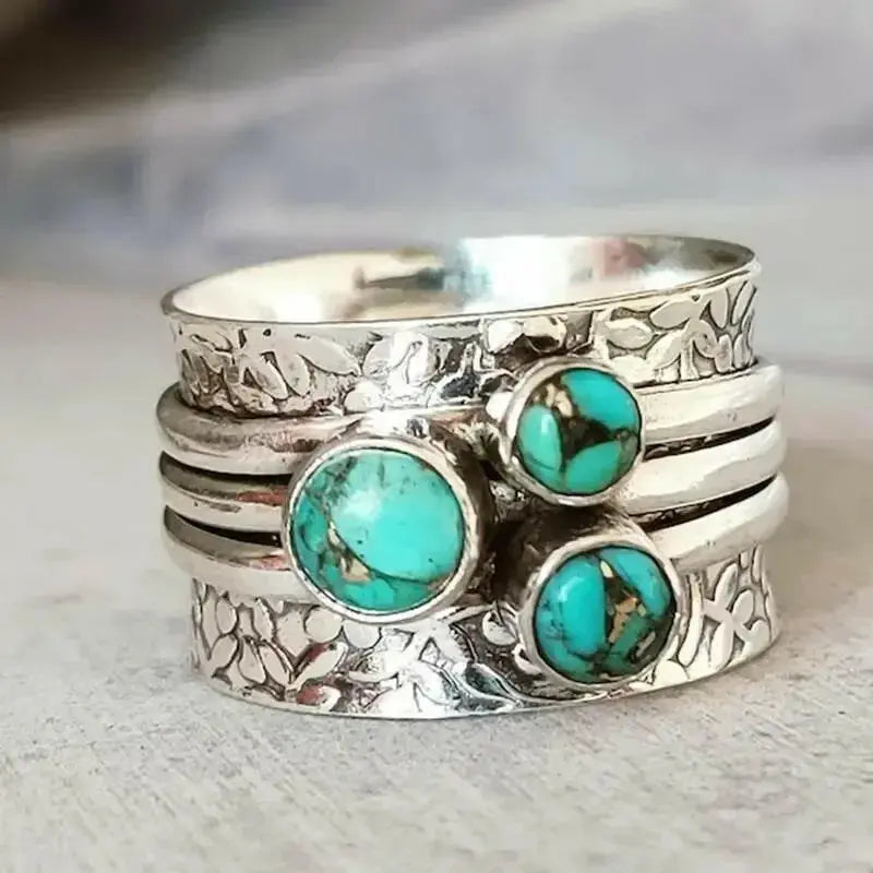 Vintage three-eye turquoise hammered ring showcasing boho style and handcrafted metalwork, perfect for statement jewelry.