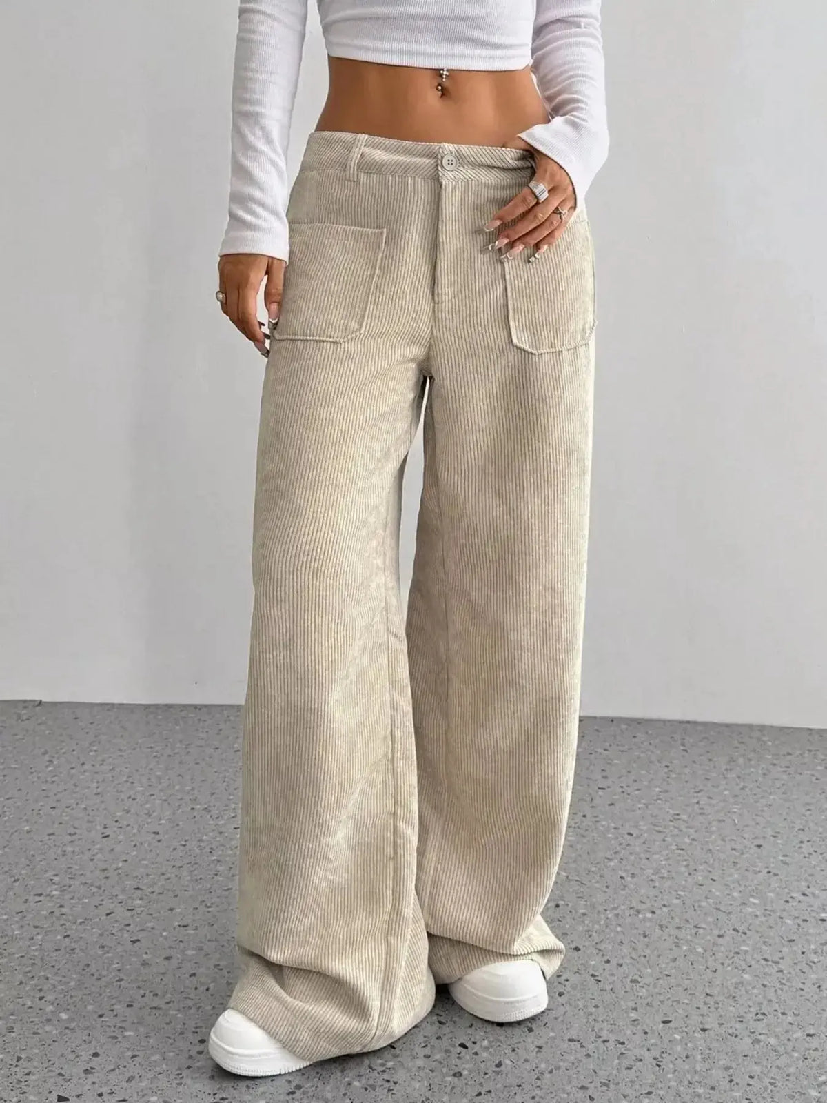 Women's high-waisted wide-leg corduroy pants from Plush Fashion Hub, showing a relaxed fit and textured fabric in a neutral color.