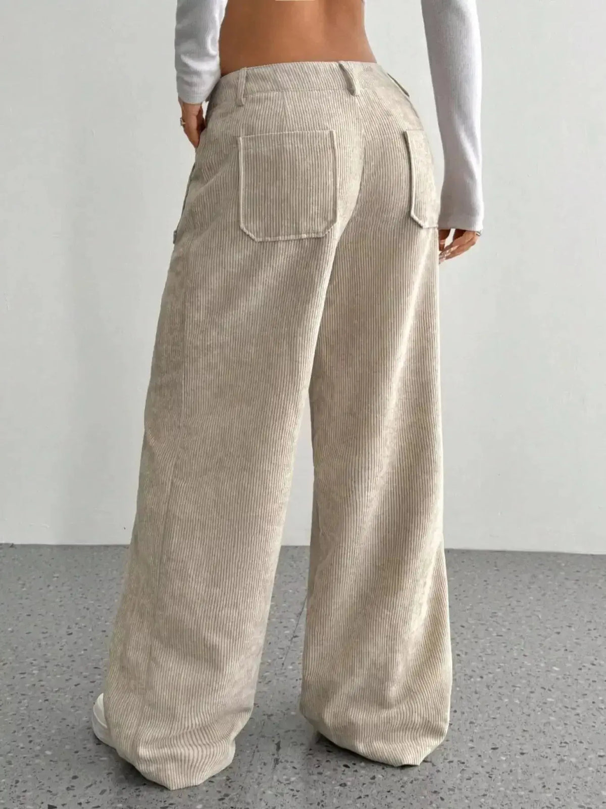 Women's high-waisted wide-leg corduroy pants by Plush Fashion Hub, shown in a rich textured fabric with a relaxed fit.
