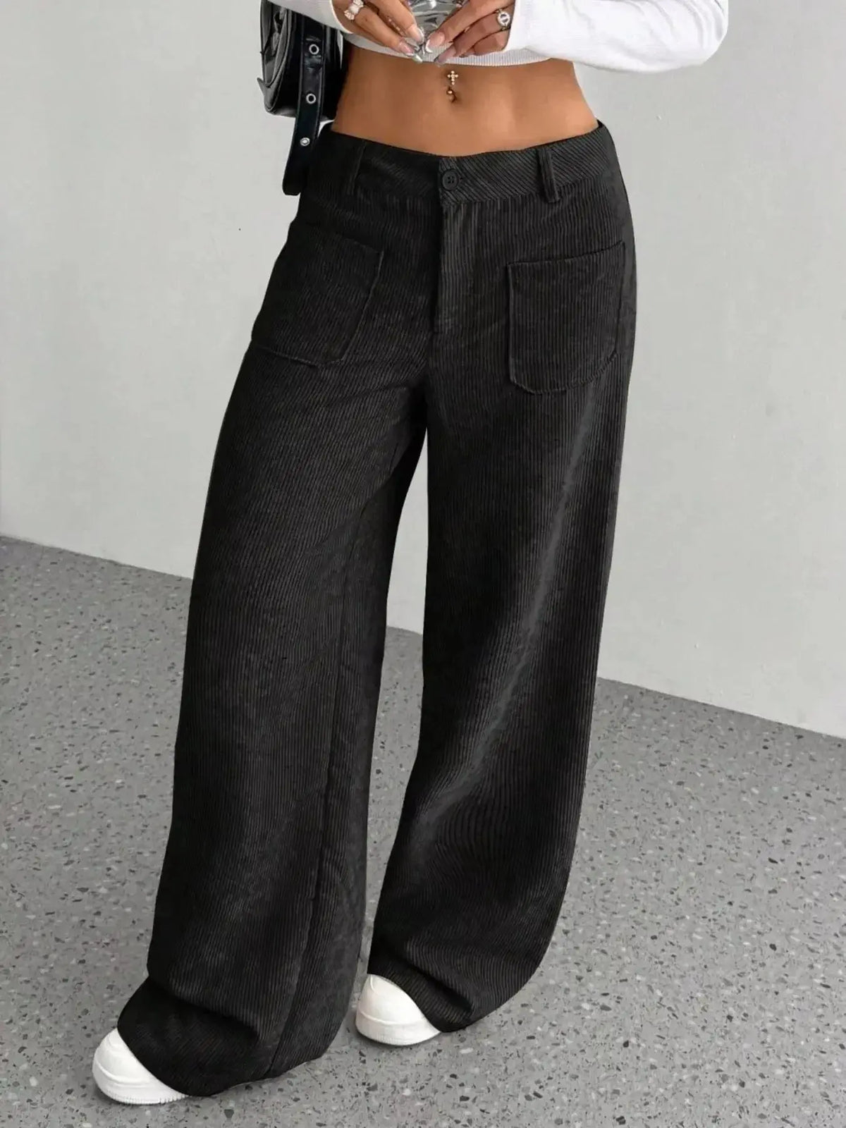 Women's high-waisted wide-leg corduroy pants by Plush Fashion Hub, showcasing the textured fabric and relaxed fit.
