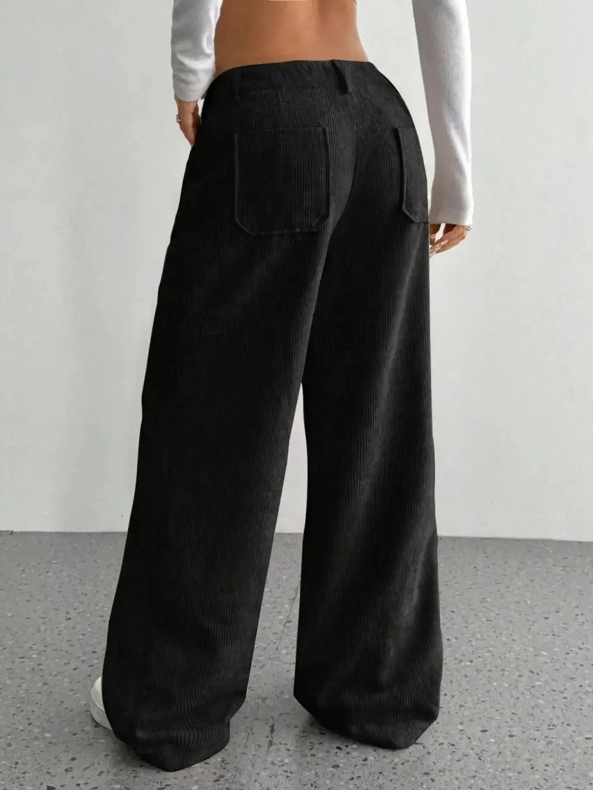 Women’s high-waisted wide-leg corduroy trousers by Plush Fashion Hub, shown in a beige color with a relaxed fit and front pockets.