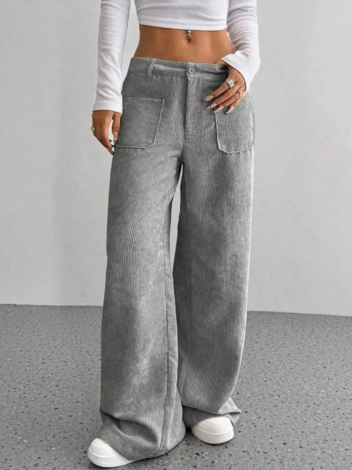 Women's high-waisted wide-leg corduroy trousers by Plush Fashion Hub, featuring a relaxed fit and textured fabric.