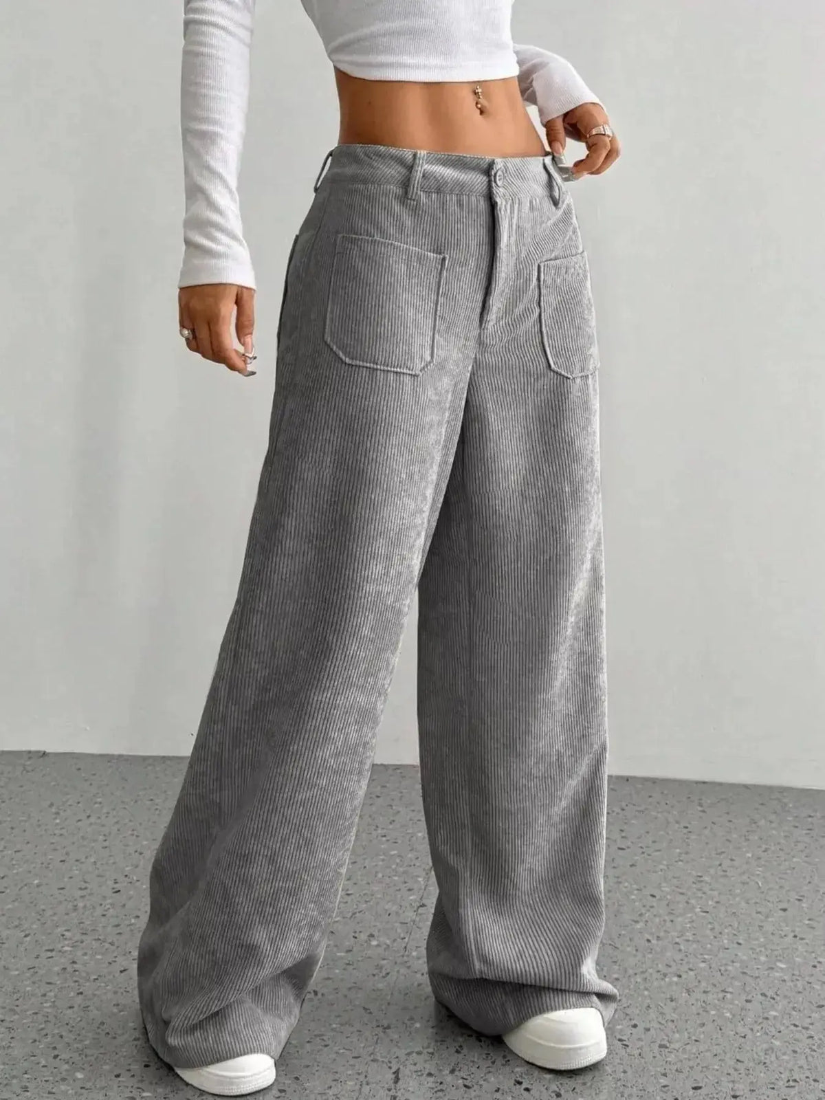 Women's high-waisted wide-leg corduroy trousers by Plush Fashion Hub, featuring a relaxed fit and textured fabric.