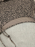 Women's leopard print pajama set with cami, shorts, and cardigan from Trendsi, featuring a stylish and comfortable lounge outfit.