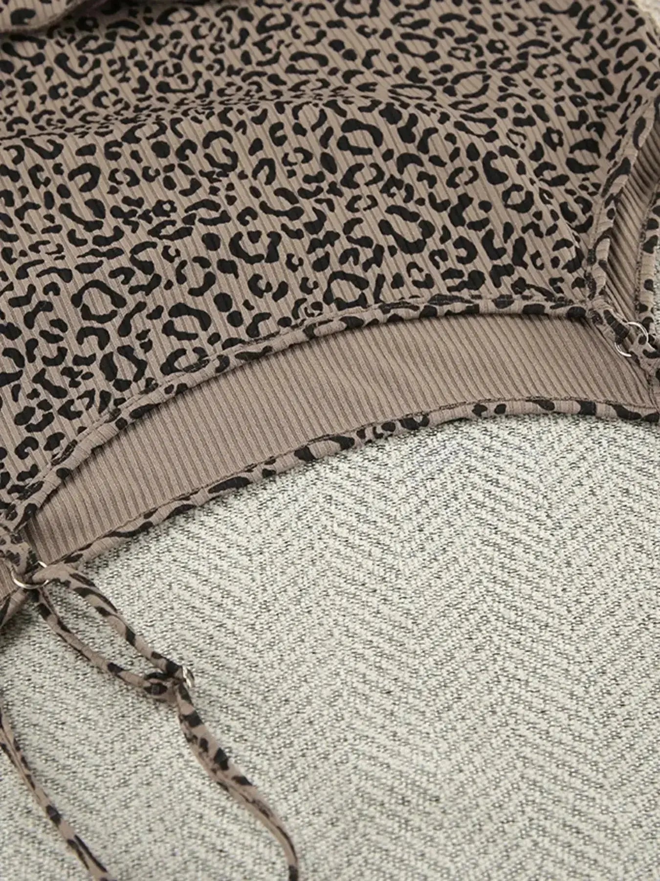 Women's leopard print pajama set with cami, shorts, and cardigan from Trendsi, featuring a stylish and comfortable lounge outfit.