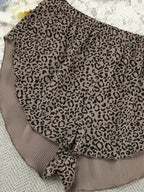 Women’s leopard print pajama set with cami, shorts, and cardigan, trendy lounge sleepwear by Trendsi.
