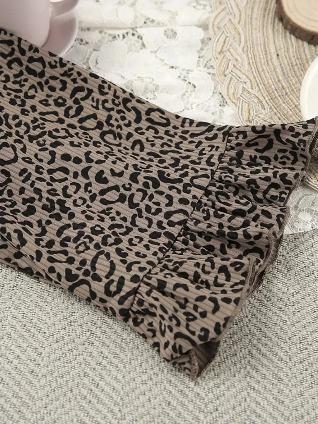 Women's leopard print pajama lounge set with cami, shorts, and cardigan by Trendsi, featuring a stylish and comfortable sleepwear ensemble.
