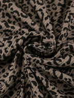 Women's leopard print pajama lounge set with cami, shorts, and cardigan by Trendsi, featuring a stylish and comfortable sleepwear outfit.