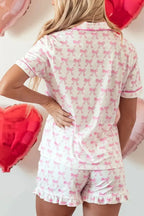 Women's bow detail pajama lounge set with soft polyester shorts and matching shirt, comfortable sleepwear by Trendsi.
