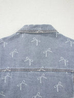 Light wash denim jacket with bow knot print, raw hem, and classic fit, designed for women by Trendsi.