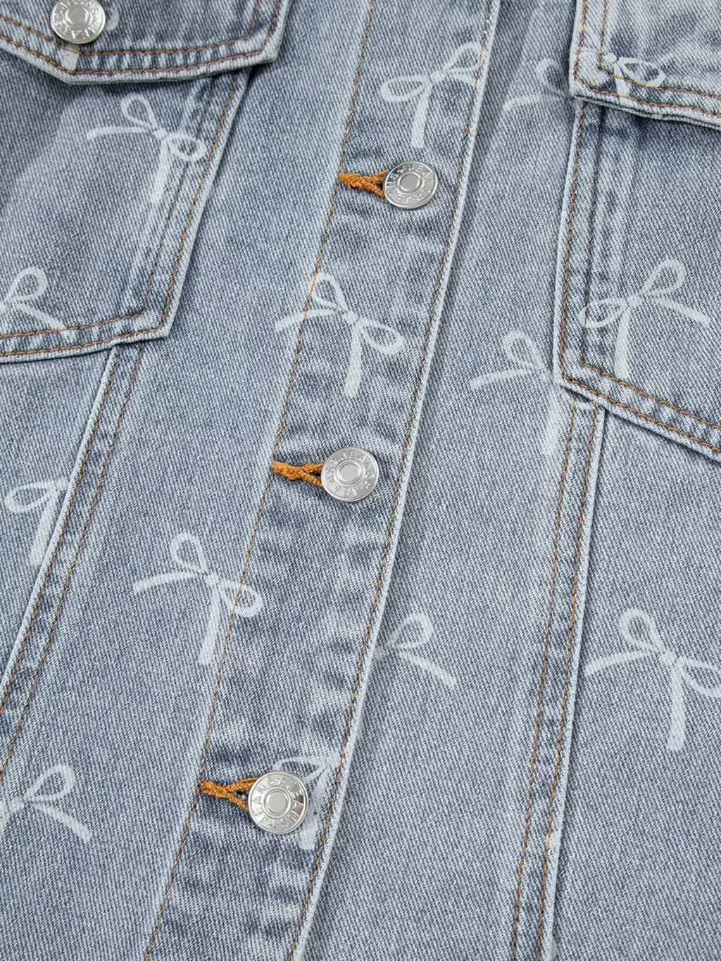 Women's light wash denim jacket with bow knot print and raw hem, stylish Trendsi denim jacket for casual wear.