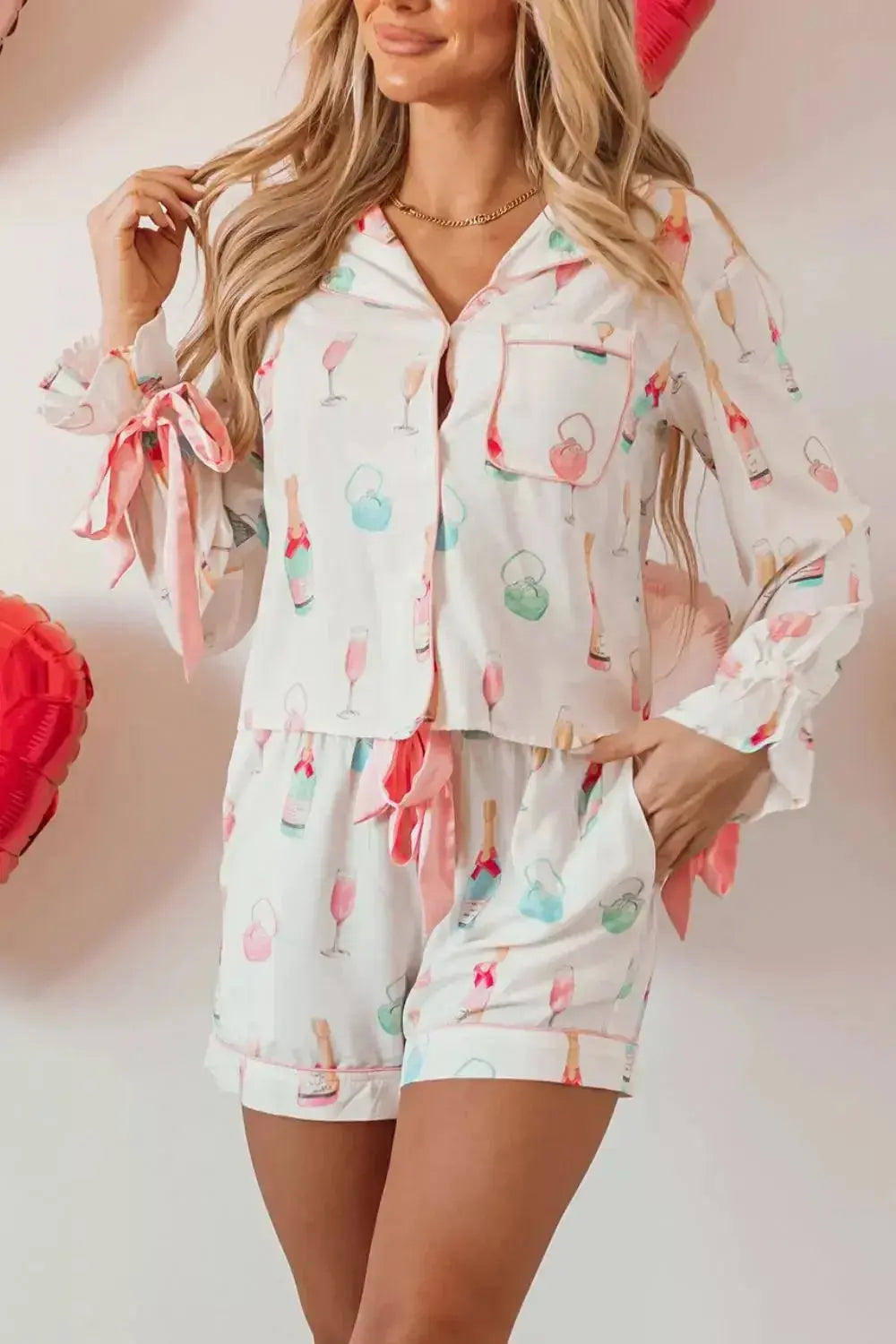 Women's bow print collared lounge top and drawstring shorts pajama set by Trendsi, comfortable sleepwear for women.