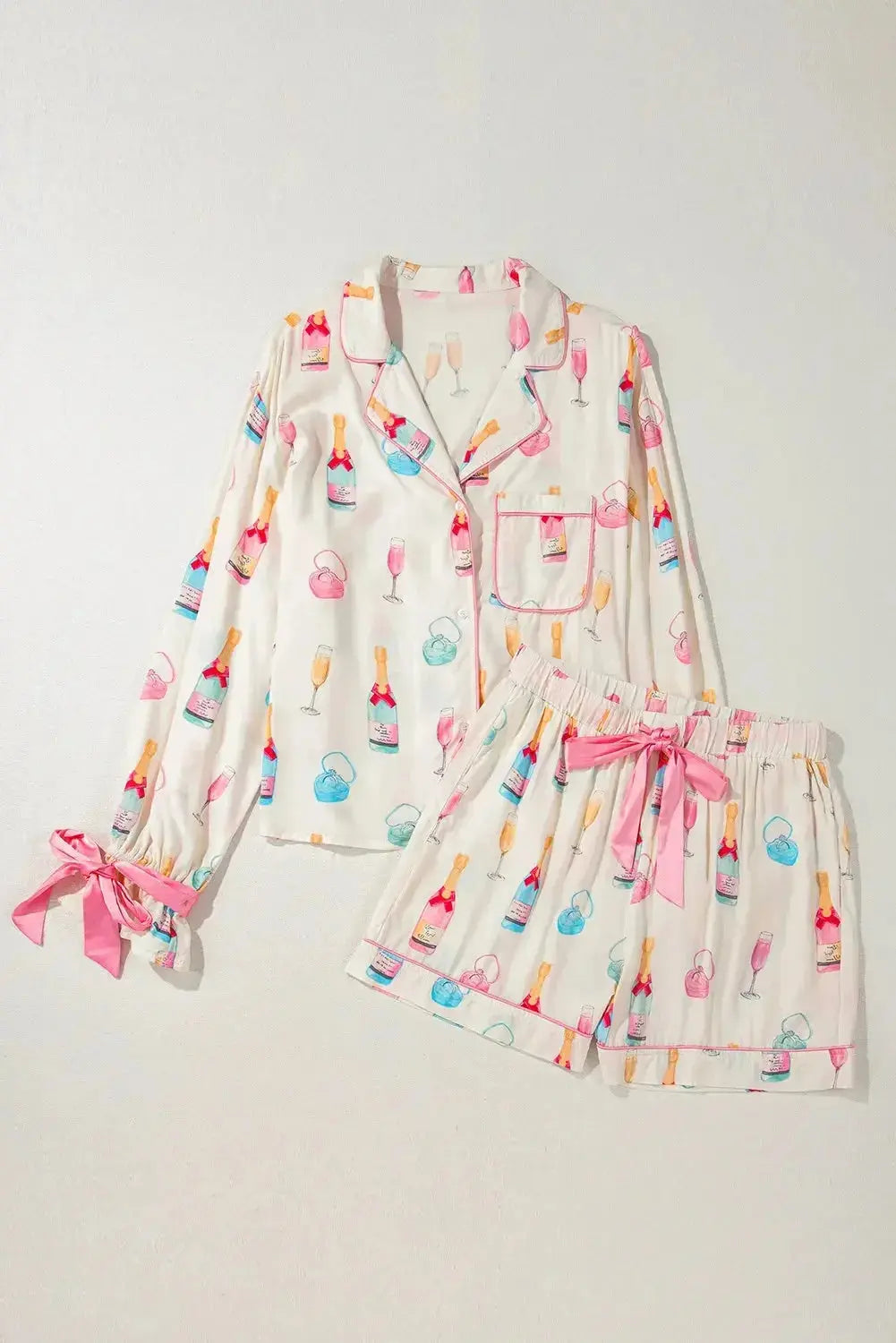 Women’s bow print collared lounge top and drawstring shorts pajama set from Trendsi, featuring a comfortable, stylish pajama ensemble.