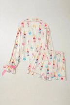 Women’s bow print collared lounge top and drawstring shorts pajama set by Trendsi, cozy sleepwear for women.