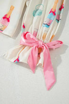 Women’s bow print collared lounge top and drawstring shorts pajama set by Trendsi, casual sleepwear with a relaxed fit.