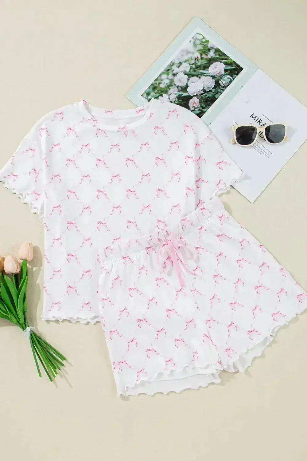 Women's bow print lettuce trim lounge set by Trendsi, soft pajamas with matching shorts, featuring a cozy and stylish design.