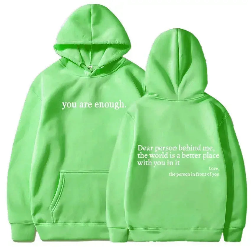 Women’s brushed fleece hoodie with letter graphic from Plush Fashion Hub, soft oversized pullover in a cozy, casual style.