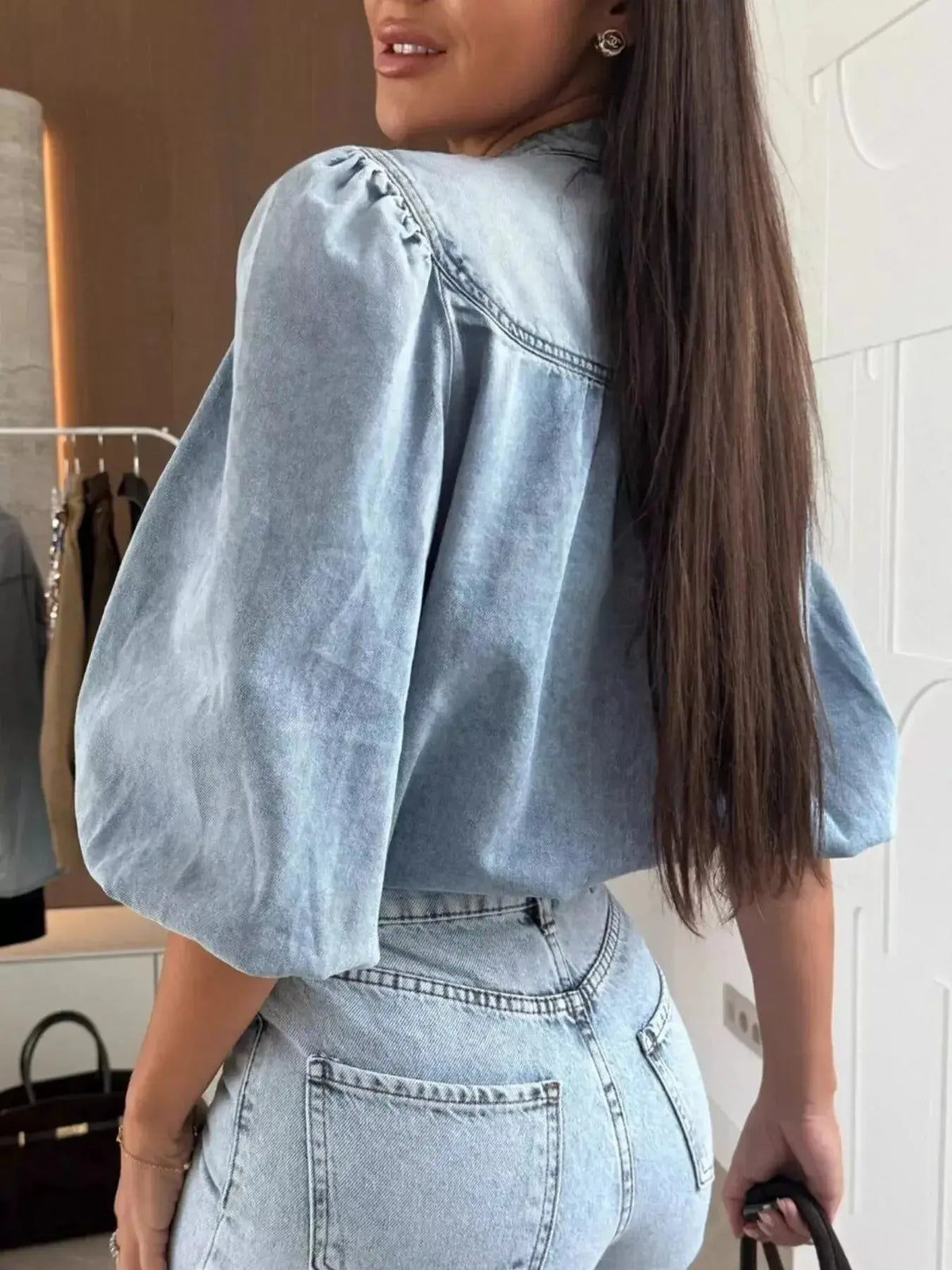 Women’s blue denim button-down blouse with puff sleeves by Plush Fashion Hub, featuring a structured, casual chic style.