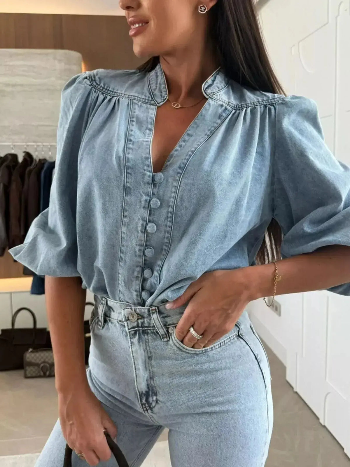 Women’s blue denim button-down blouse with puff sleeves and structured casual chic design by Plush Fashion Hub.