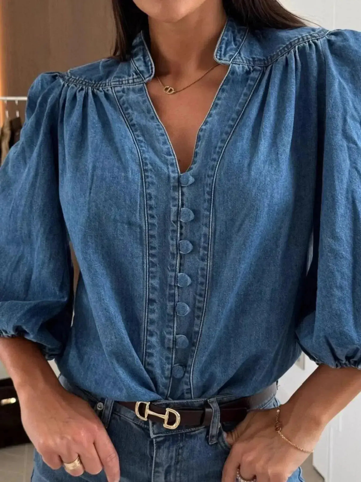 Women’s blue denim button-down blouse with puff sleeves, structured casual chic style from Plush Fashion Hub.