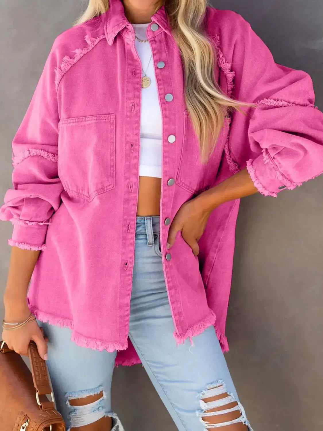 Women's cotton blend denim jacket with button-down front and raw hem, casual outerwear by Plush Fashion Hub.