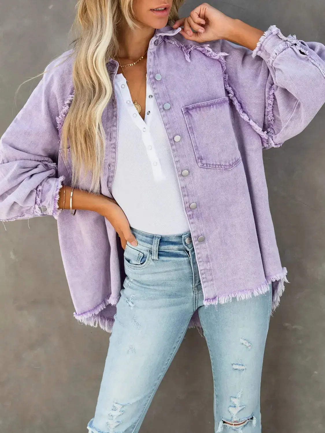 Women’s cotton blend denim jacket with button-down front and raw hem, casual outerwear by Plush Fashion Hub.