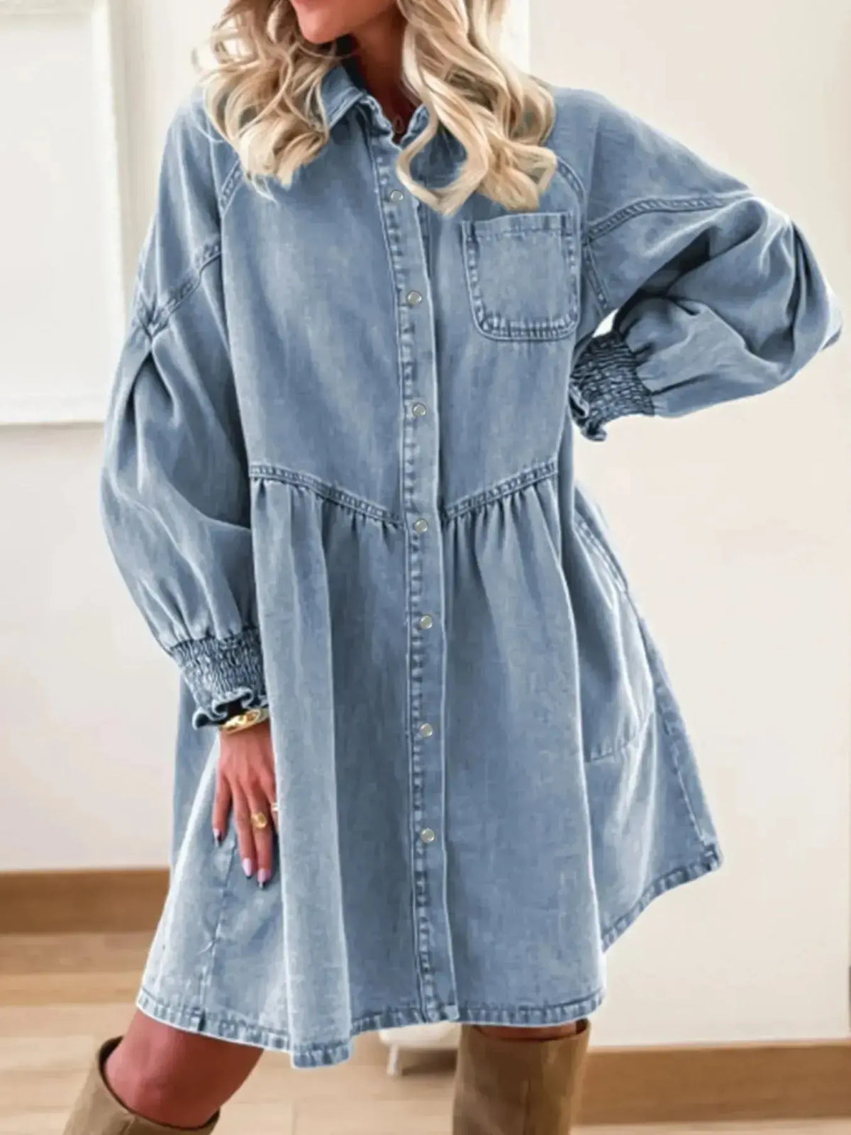 Women’s casual denim shirt dress with button-up front and smocked cuffs by Plush Fashion Hub, styled for a relaxed look.