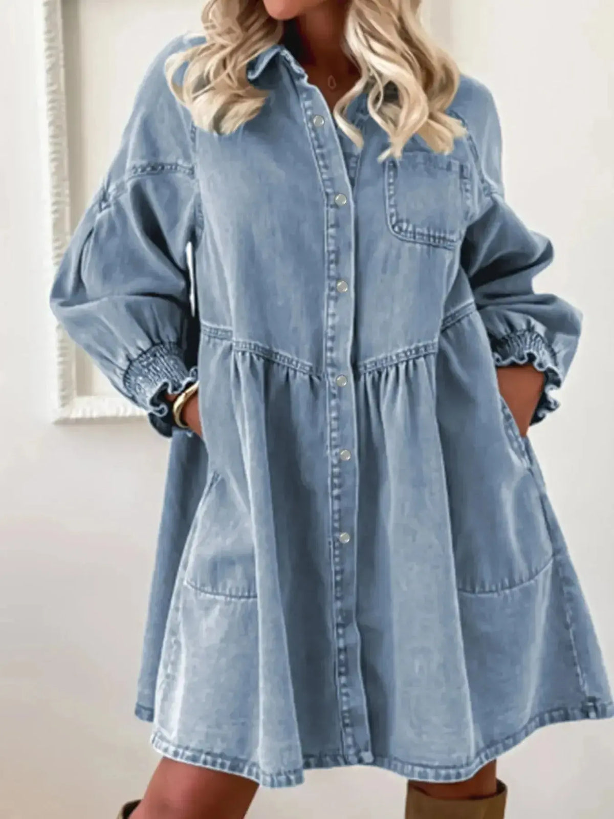 Women’s casual denim shirt dress by Plush Fashion Hub with button-up front and smocked cuffs, styled for a relaxed look.