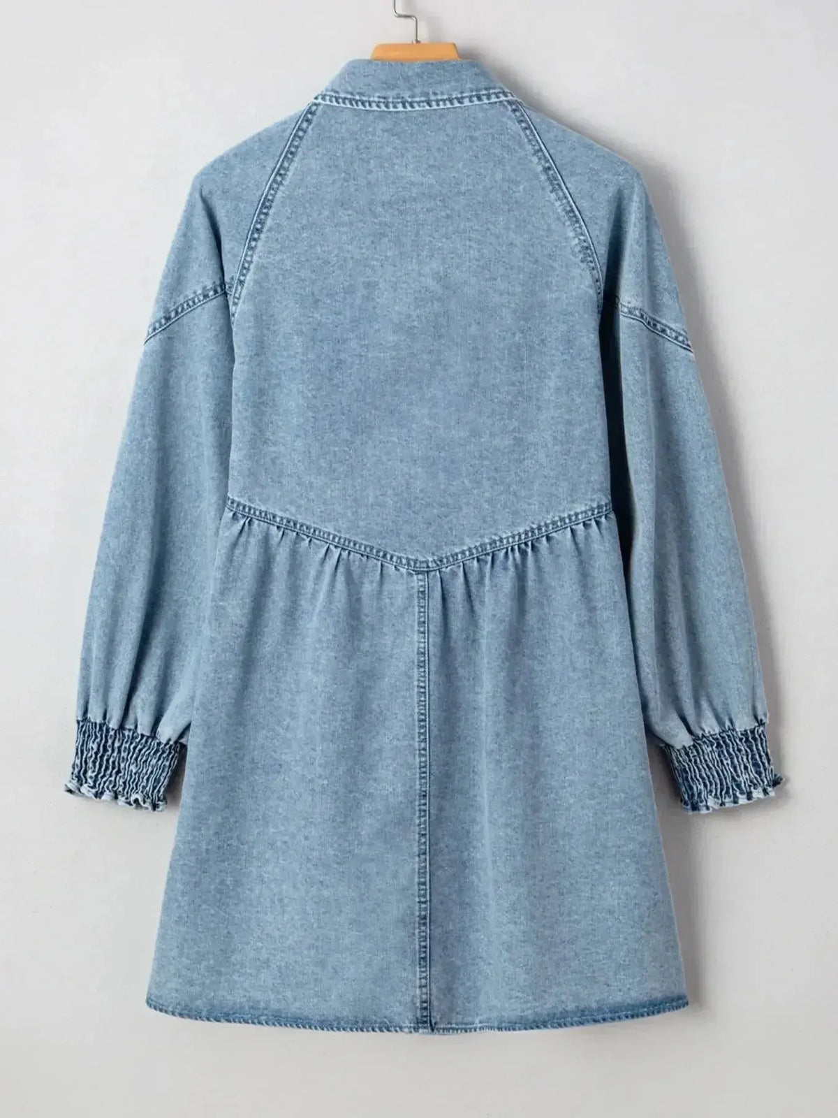 Women’s casual denim shirt dress with button-up front and smocked cuffs, stylish and comfortable by Plush Fashion Hub.
