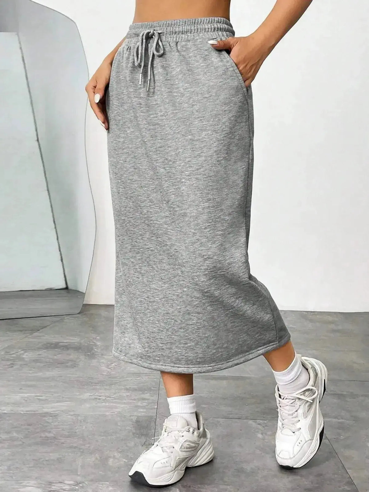Women’s casual drawstring midi skirt with pockets and side slit by Plush Fashion Hub, shown in a relaxed, stylish fit.