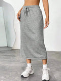 Women's casual drawstring midi skirt with pockets and side slit, trendy skirt from Trendsi, shown in a relaxed, stylish fit.