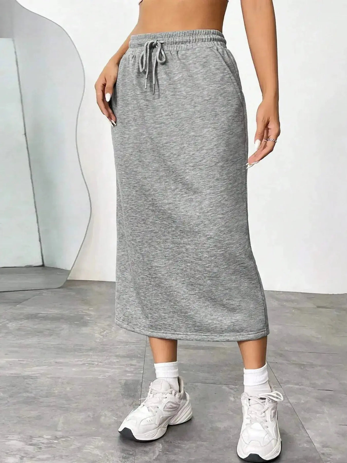 Women’s casual drawstring midi skirt by Plush Fashion Hub featuring side slit and pockets, perfect for everyday wear.