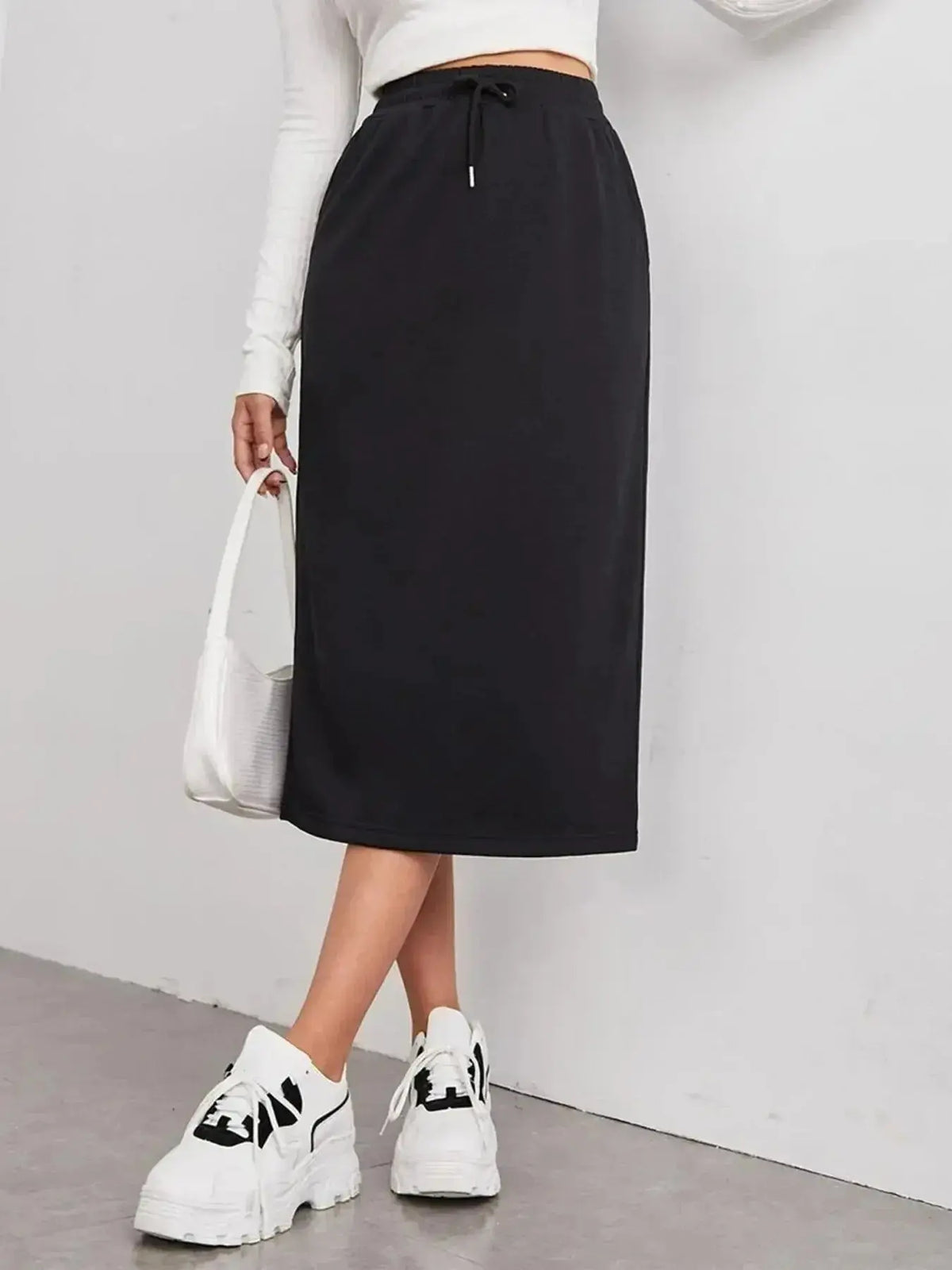 Women’s casual drawstring midi skirt with pockets and side slit, stylish comfort from Plush Fashion Hub, shown in a natural pose.