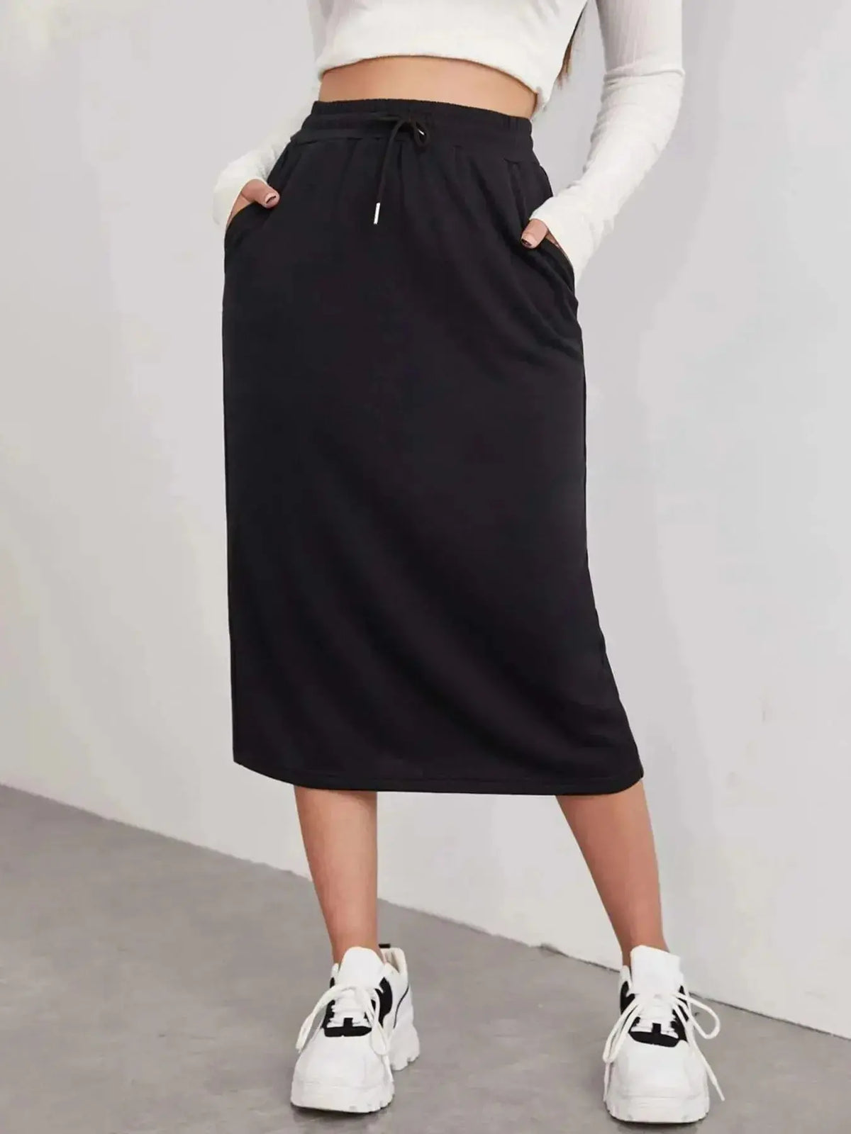 Women’s casual drawstring midi skirt with pockets and side slit, made by Plush Fashion Hub, shown in a relaxed everyday style.