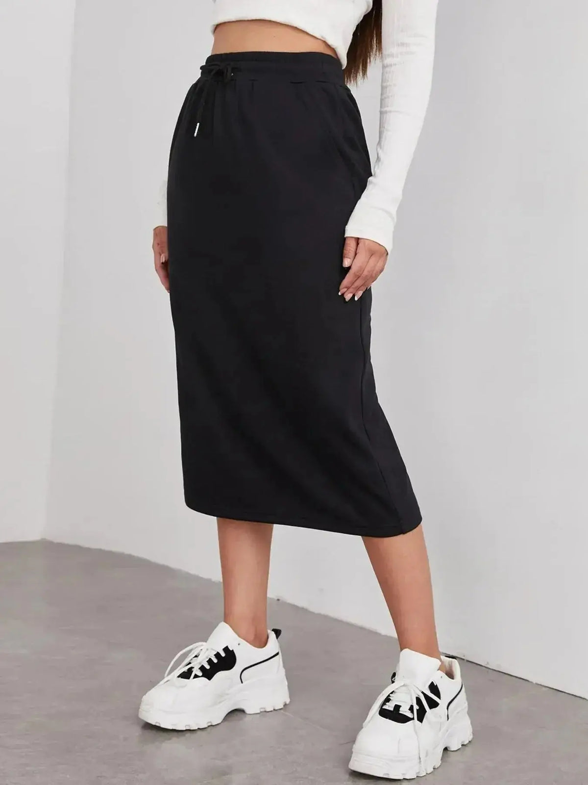Women’s casual drawstring midi skirt with side slit and pockets, by Plush Fashion Hub, shown with a relaxed fit and stylish design.