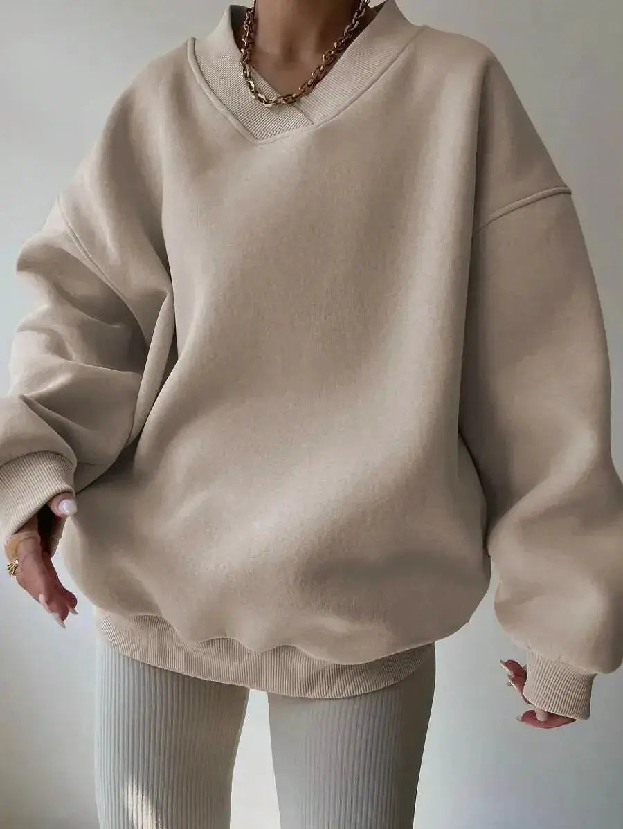 Women’s soft long sleeve crew neck sweater in a solid color, casual knit pullover by Plush Fashion Hub.