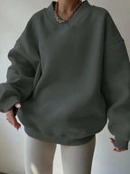 Women’s soft long sleeve crew neck sweater by Plush Fashion Hub, solid color knit pullover perfect for casual wear.